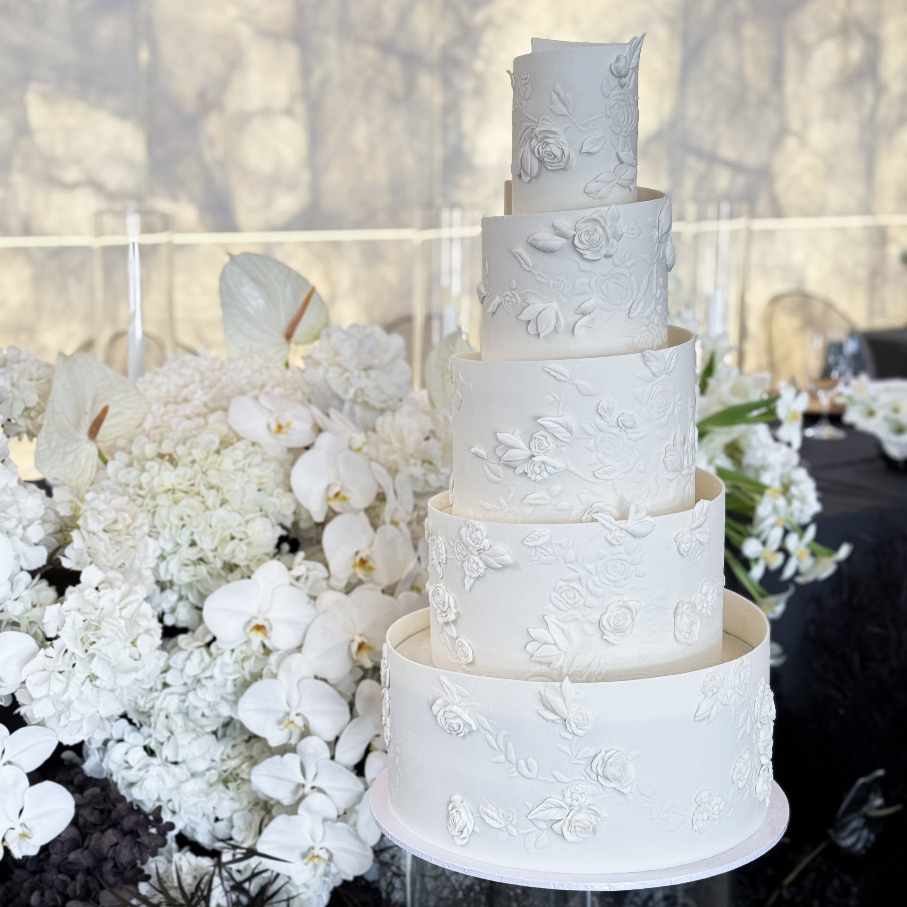 5 tier wedding cake with BAS relief detailing and sugar past flower texture. 