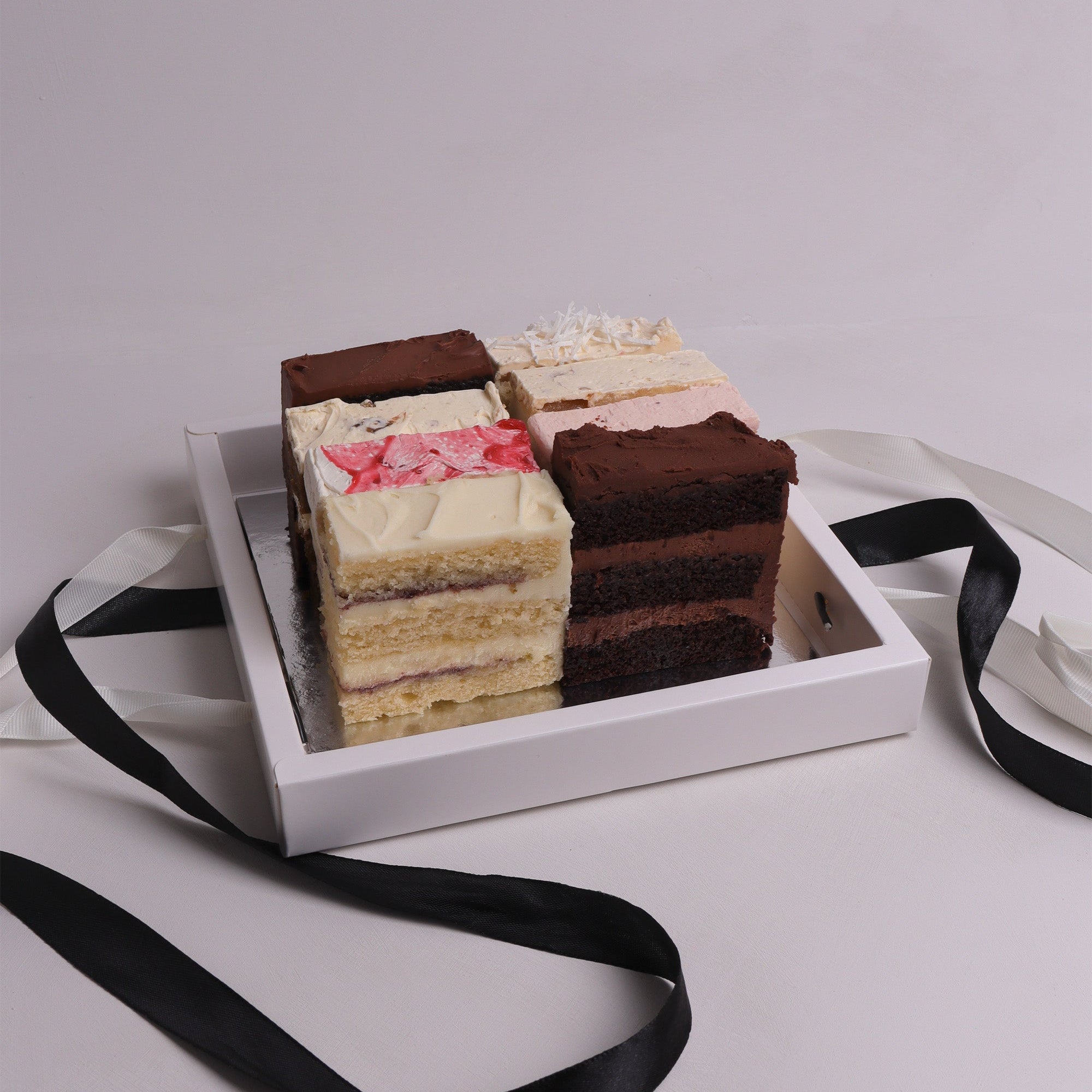 Wedding cake tasting box with 8 luxury flavours. sample box for Melbourne weddings and events